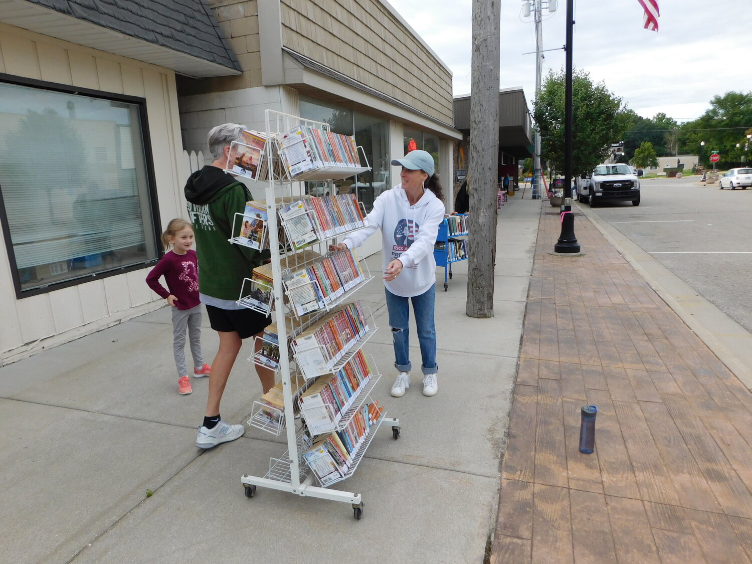 Many hands – and feet – take on the task of moving Harrison District Library’s collection into its new home one block north on Second Street.